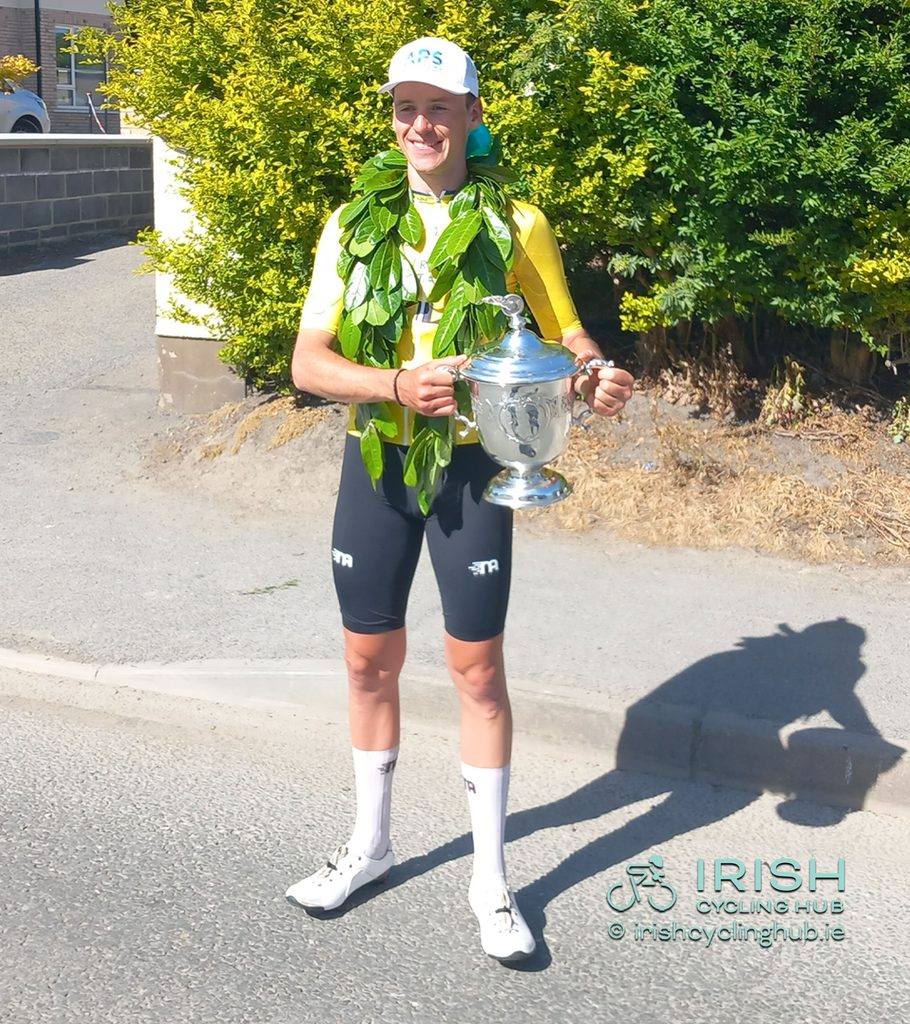 2026 Rás Tailteann Champion Conn McDunphy, APS Pro Cycling by Team Cadence Cyclery, poses with the George Plant Trophy. 