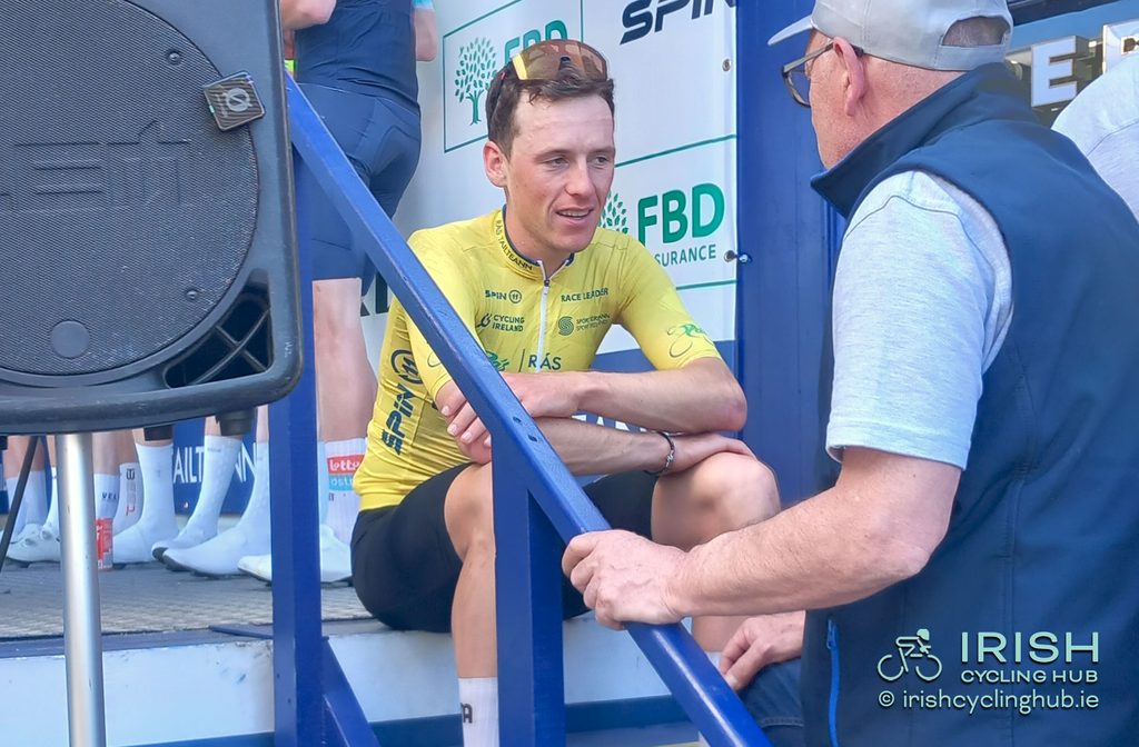 2026 Rás Tailteann Champion hasn't quite sunk in yet, McDunphy, APS Pro Cycling by Team Cadence Cyclery, taking his victory in on the steps of the podium in Dunboyne after Stage 5.