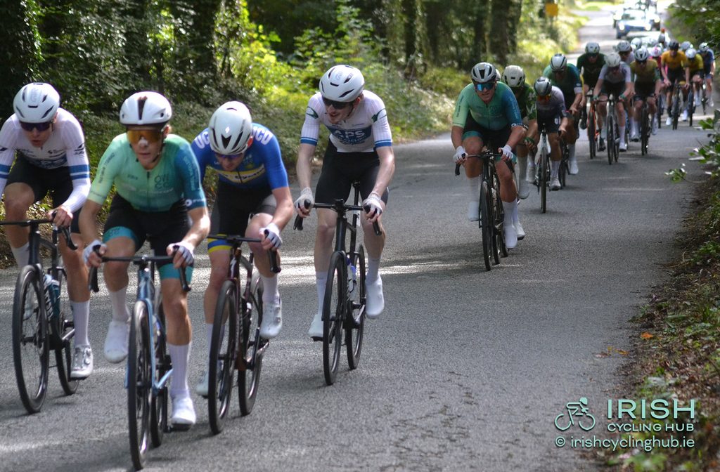Padraig Moran, Pinergy Orwell Wheelers, leading over the climb with the peloton strung out behind.