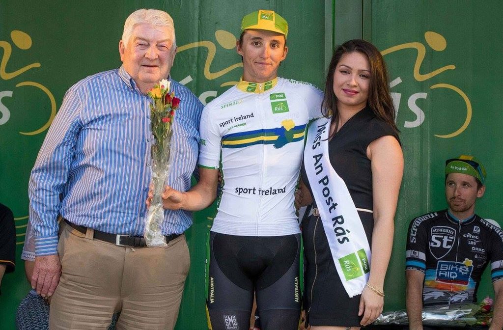 The late Paudie Fitzgerald with Jai Hindley, U23 Sport Ireland Jersey Winner, Jai Hindley, Team Australia, future Giro d'Italia winner (2022), and Miss An Post Rás Dingle Katriona Dackona after Stage 3, 2016 An Post Rás Tailteann, Charleville to Dingle.