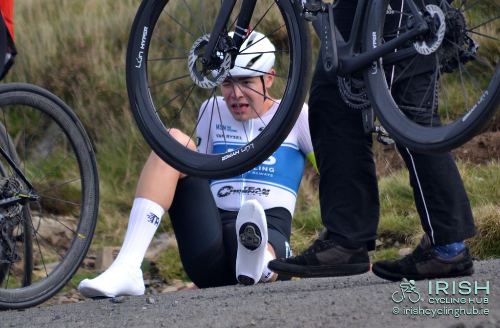 Matthew Walls recovers seated on the ground after the effort needed to win a National title.