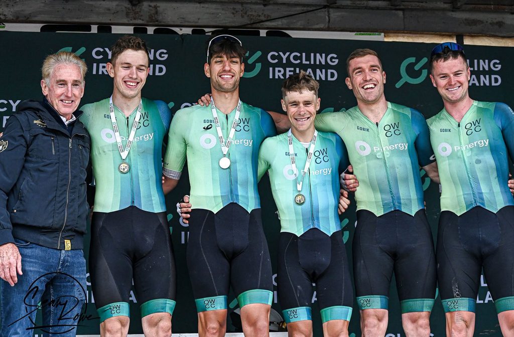 Seán O'Kane and his Pinergy Orwell Wheelers teammates with their 2026 Irish National Elite Men's Road Race Team medals beside Irish cycling legend Seán Kelly.
